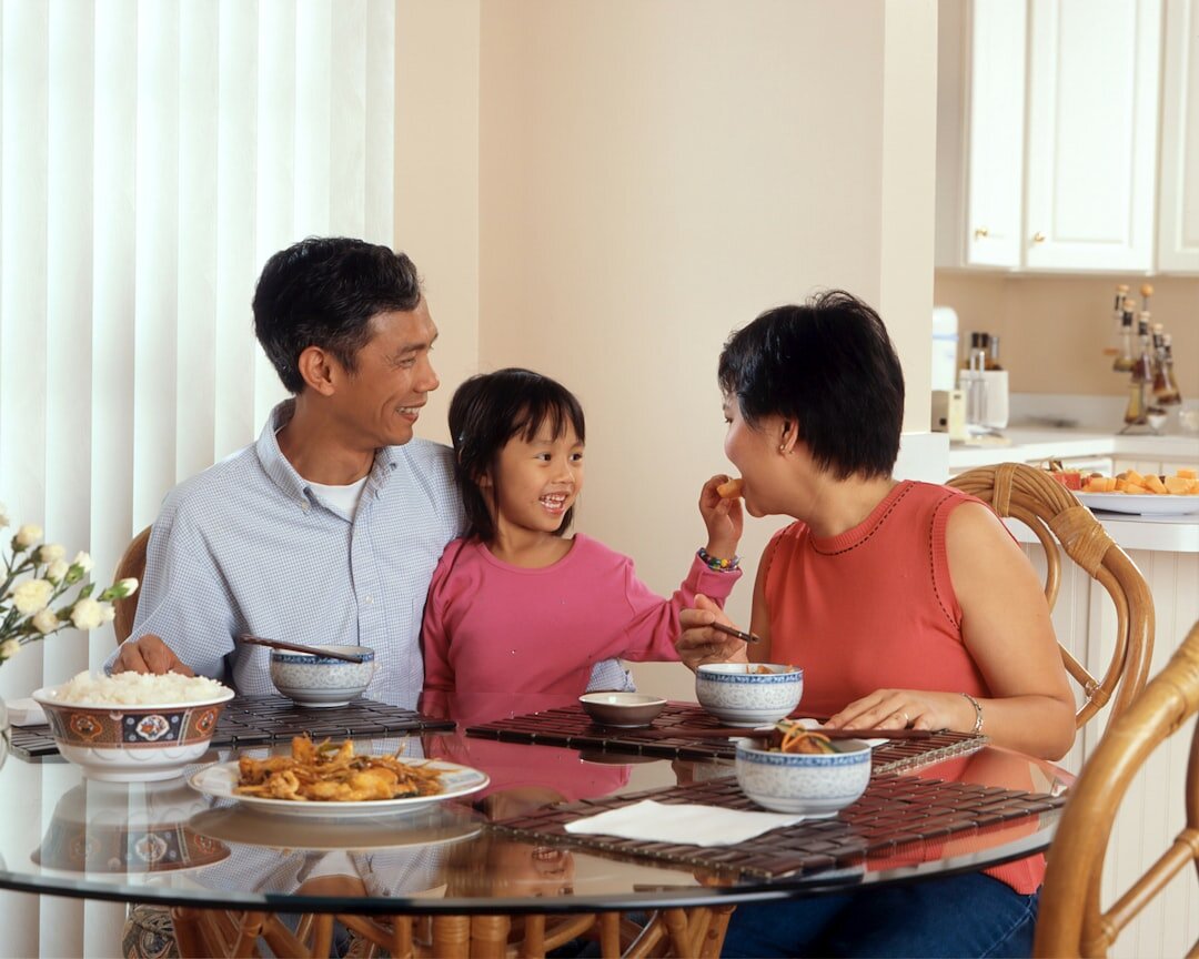 Family sitting at a table reviewing estate planning documents together
