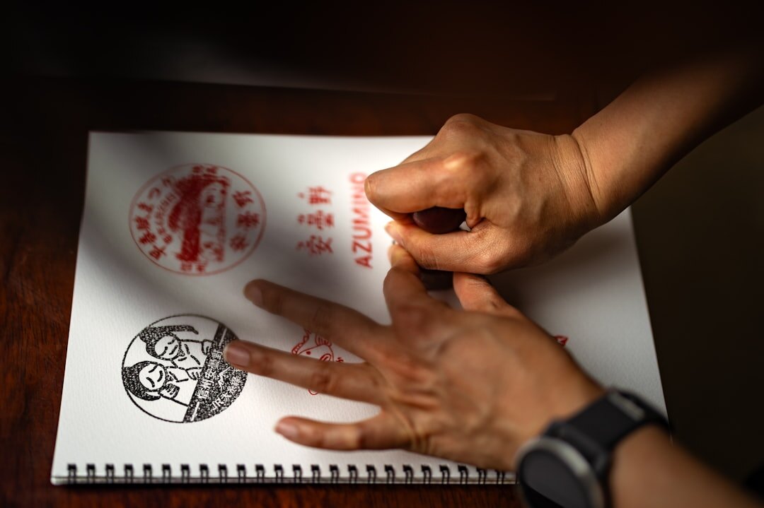 Close-up of a notary stamp being pressed onto an official document